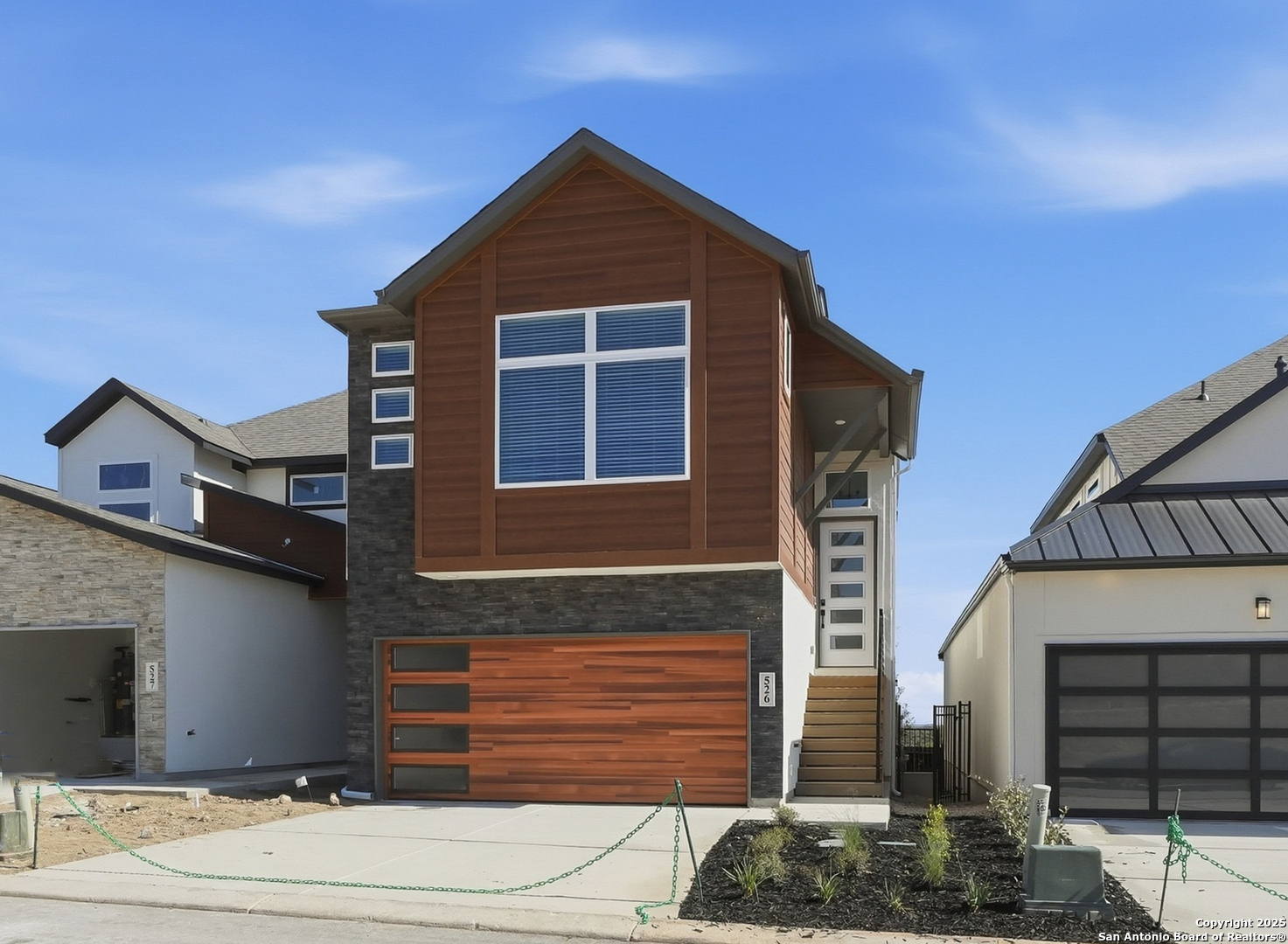 20675 Huebner Road, Unit 526 San Antonio, TX 78258 - Photo 2 of 45 a front view of a house with garage