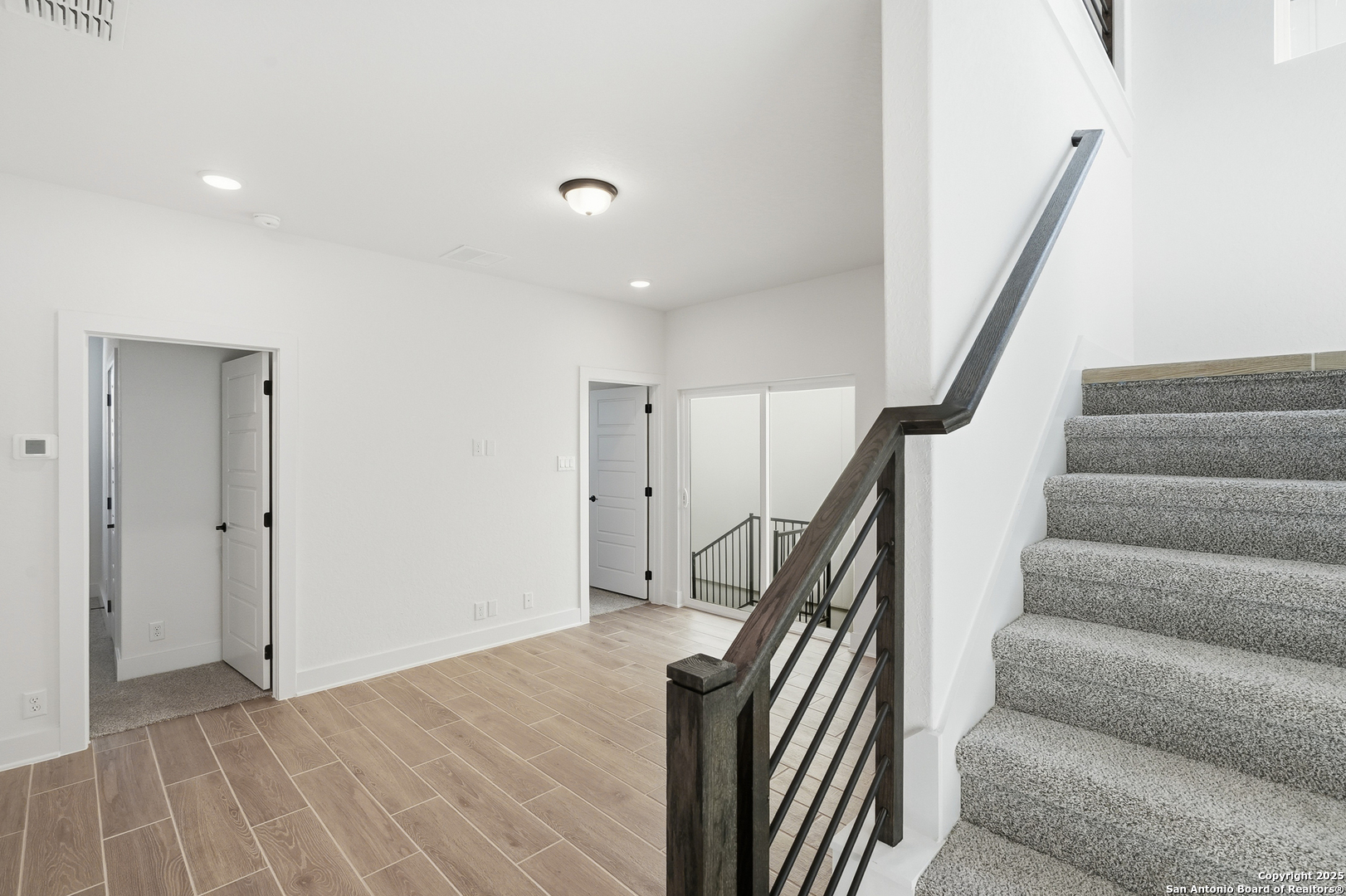 20675 Huebner Road, Unit 526 San Antonio, TX 78258 - Photo 28 of 45 a view of entryway and hall with wooden floor