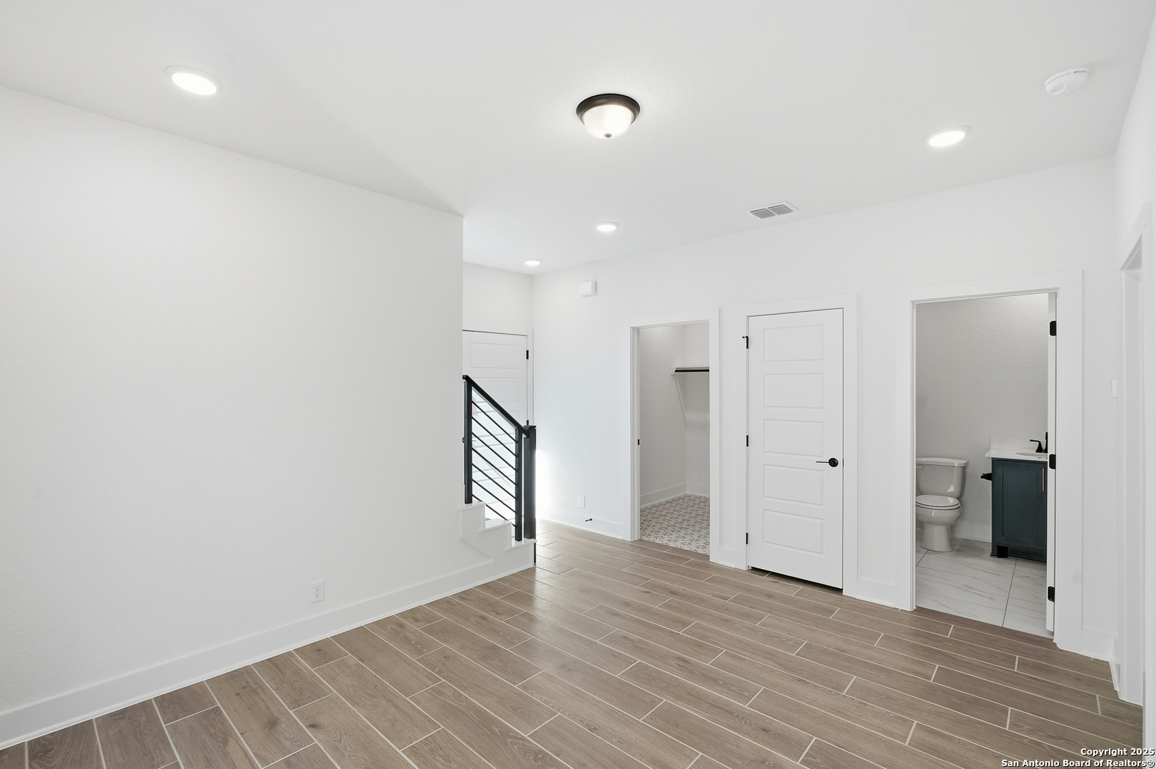 20675 Huebner Road, Unit 526 San Antonio, TX 78258 - Photo 29 of 45 a view of an empty room with wooden floor