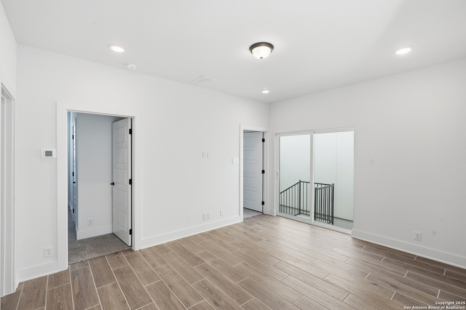 20675 Huebner Road, Unit 526 San Antonio, TX 78258 - Photo 30 of 45 a view of empty room with wooden floor