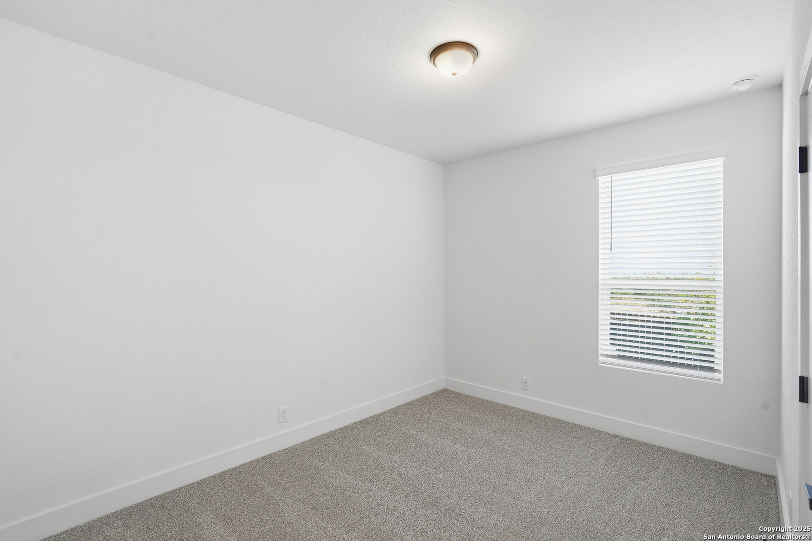 20675 Huebner Road, Unit 526 San Antonio, TX 78258 - Photo 32 of 45 an empty room with a window
