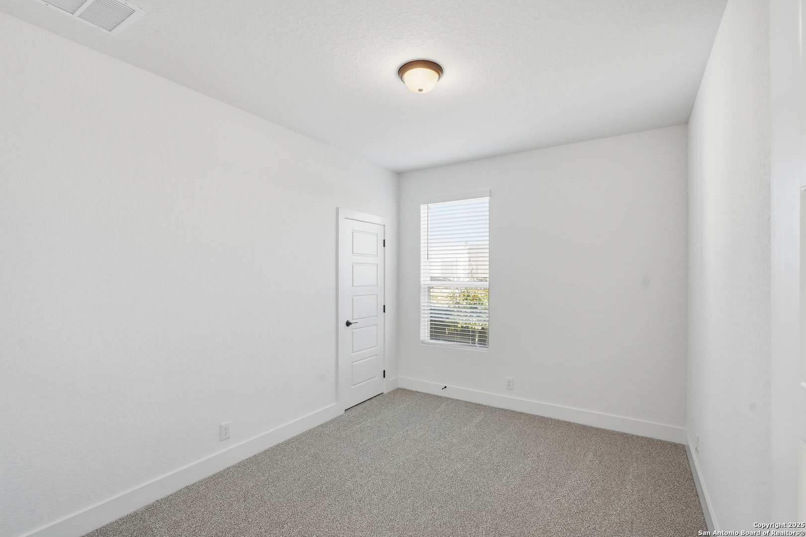 20675 Huebner Road, Unit 526 San Antonio, TX 78258 - Photo 34 of 45 a view of an empty room with a window