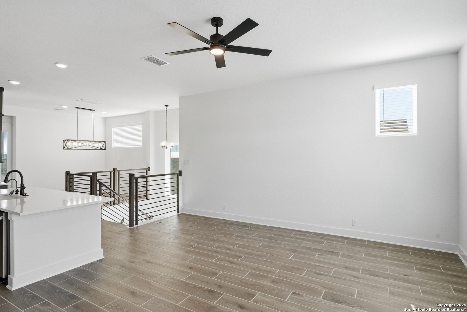 20675 Huebner Road, Unit 526 San Antonio, TX 78258 - Photo 9 of 45 a view of a kitchen with a sink and dishwasher a refrigerator with wooden floor