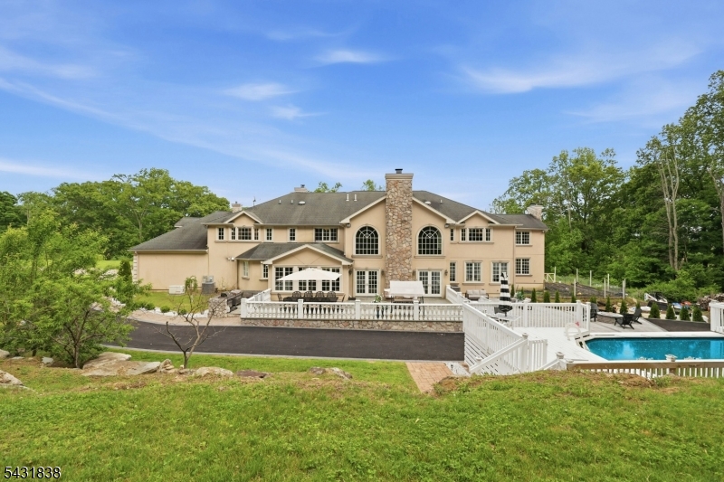 1294 Waterloo Road Stanhope, NJ 07874 - Photo 48 of 50 a view of a house with a big yard and large trees
