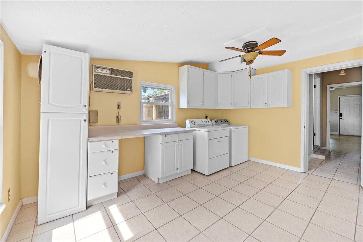 295 Garden Street Crestview, FL 32536 - Photo 18 of 33 a kitchen with a stove a sink and a refrigerator