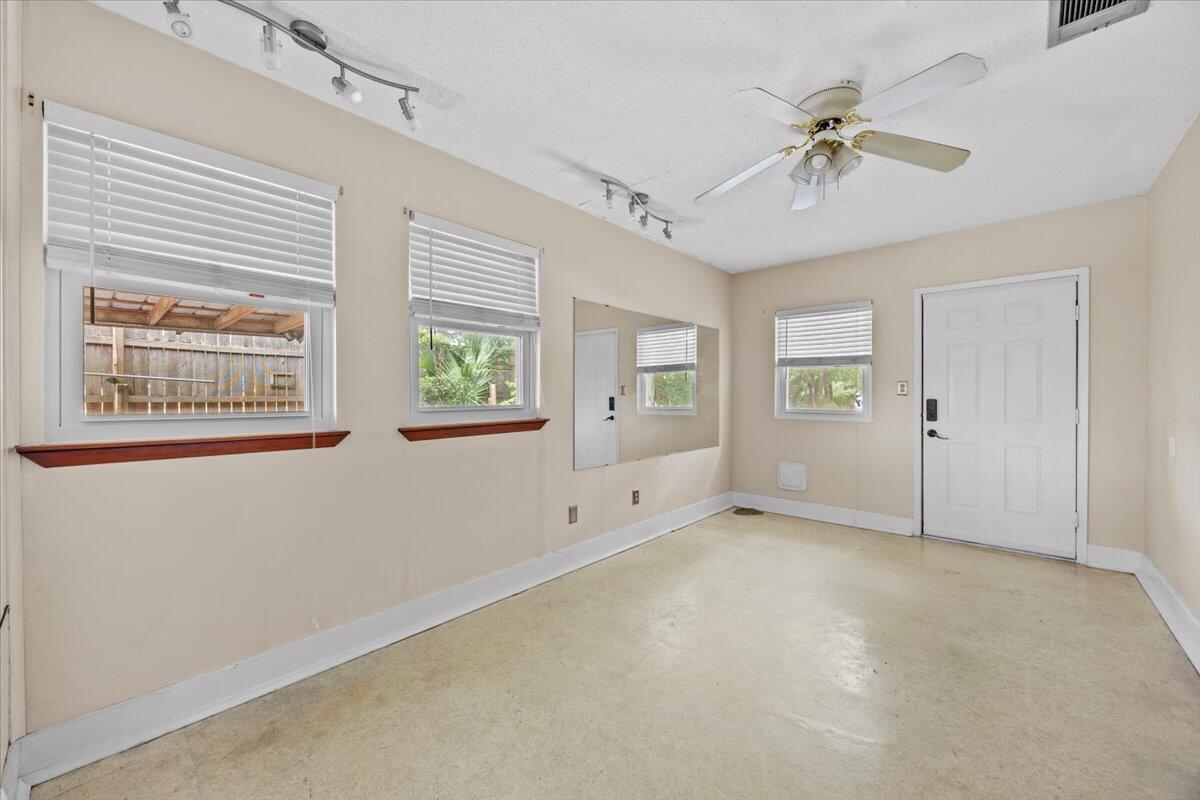 295 Garden Street Crestview, FL 32536 - Photo 20 of 33 an empty room with windows and fan