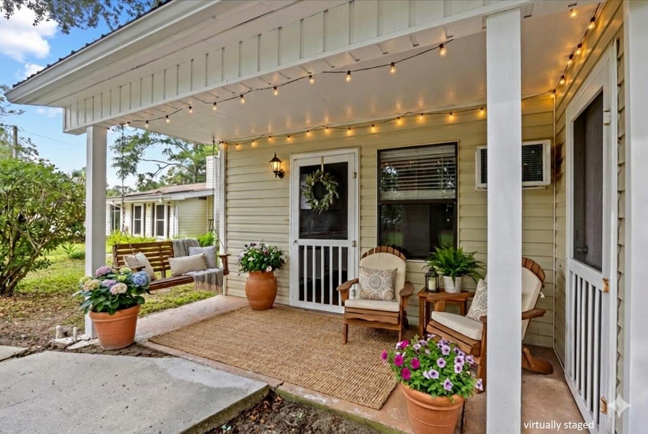 295 Garden Street Crestview, FL 32536 - Photo 23 of 33 a building outdoor space with patio furniture and potted plants