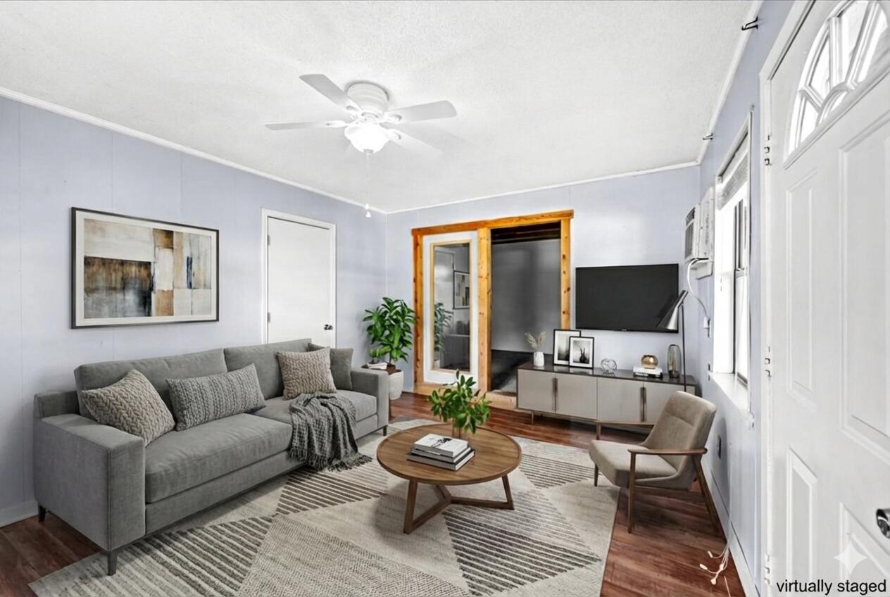 295 Garden Street Crestview, FL 32536 - Photo 26 of 33 a living room with furniture a flat screen tv and a window