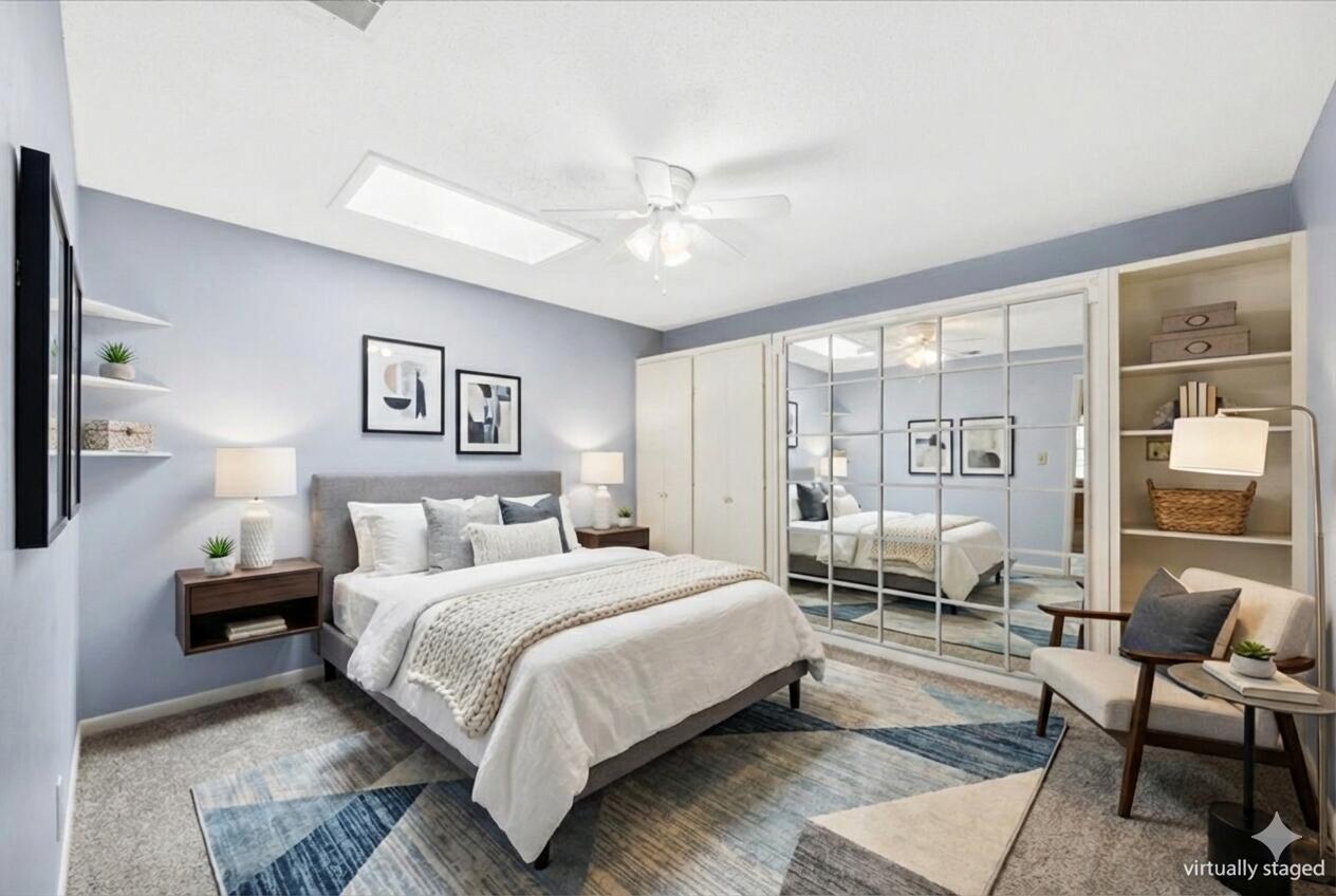 295 Garden Street Crestview, FL 32536 - Photo 6 of 33 a bedroom with a large bed couch and a window