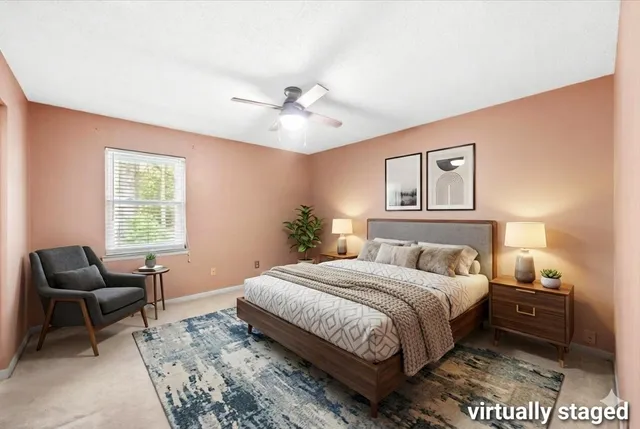 an empty room with a ceiling fan and a window