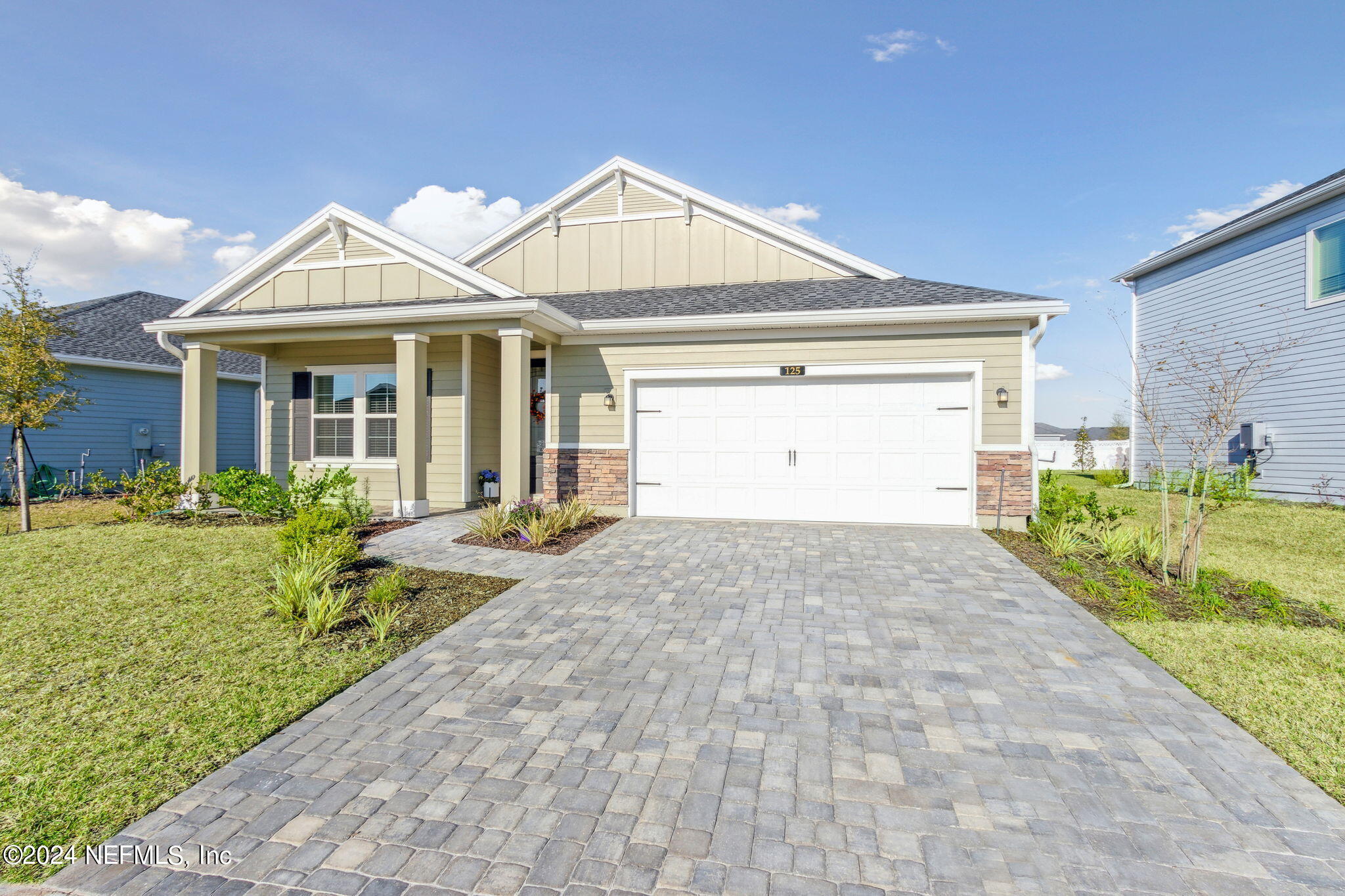 125 Varner Way St. Augustine, FL 32092 - Photo 2 of 87 a front view of a house with a yard and garage