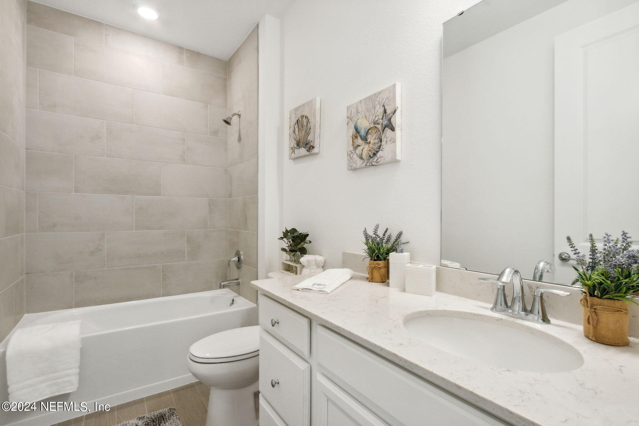 125 Varner Way St. Augustine, FL 32092 - Photo 33 of 87 a bathroom with a granite countertop sink and a mirror