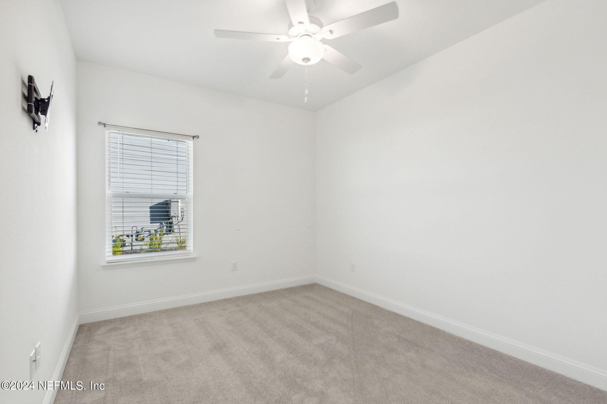 125 Varner Way St. Augustine, FL 32092 - Photo 34 of 87 an empty room with a window and a fan