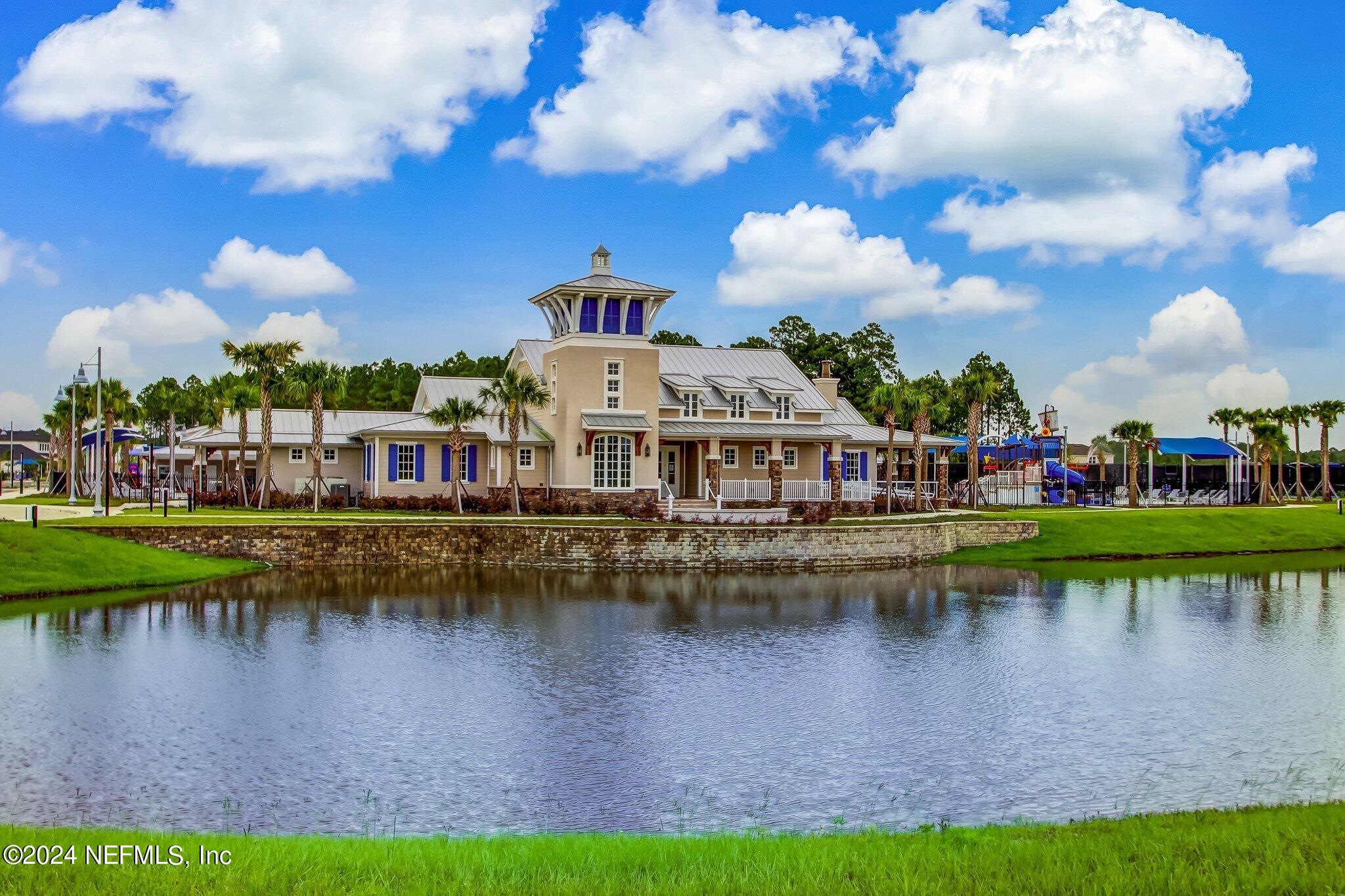 125 Varner Way St. Augustine, FL 32092 - Photo 54 of 87 a view of a lake with houses in the background