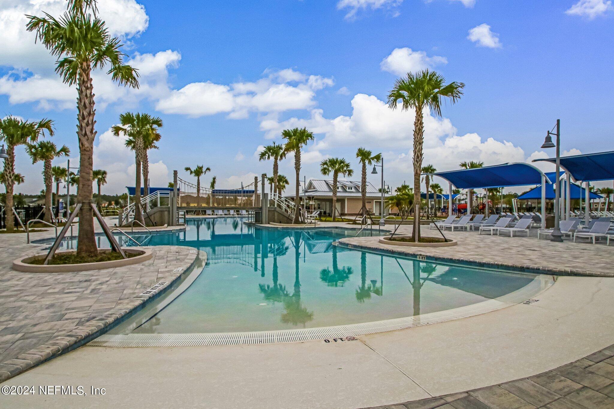 125 Varner Way St. Augustine, FL 32092 - Photo 65 of 87 a swimming pool with outdoor seating