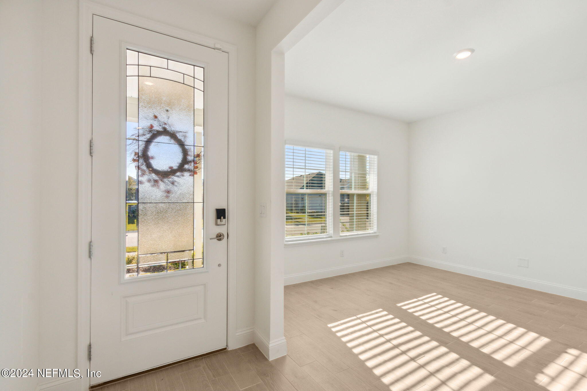 125 Varner Way St. Augustine, FL 32092 - Photo 7 of 87 a view of a room with wooden floor and windows