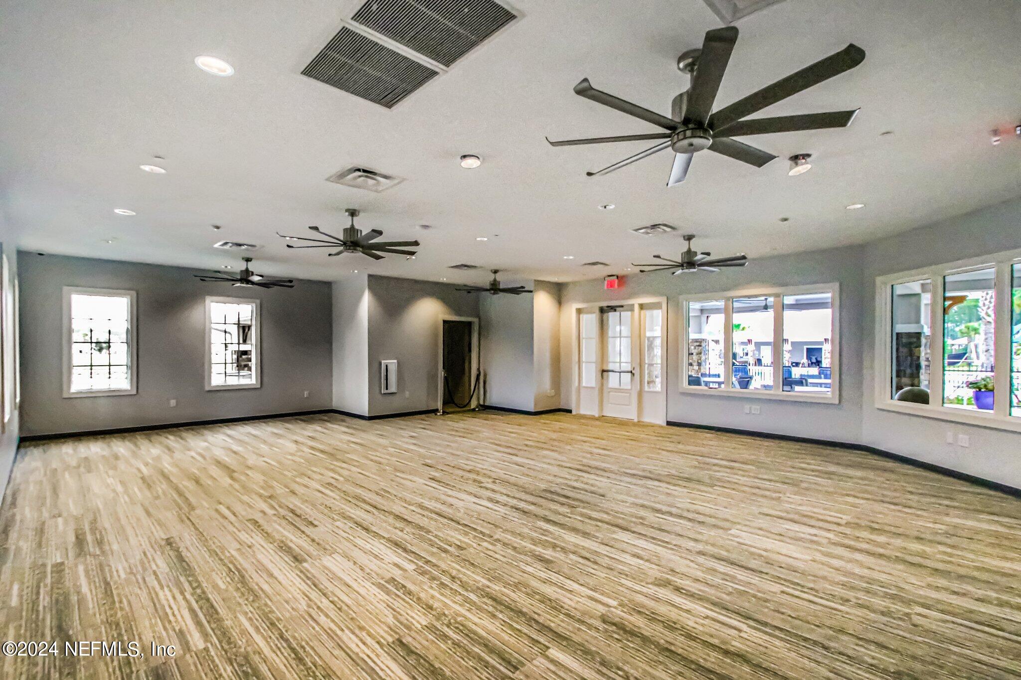 125 Varner Way St. Augustine, FL 32092 - Photo 78 of 87 a view of an empty room with a window and wooden floor