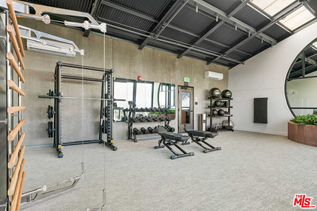 10700 Tabor Street, Unit PH5 Los Angeles, CA 90034 - Photo 22 of 26 a view of a room with gym equipment