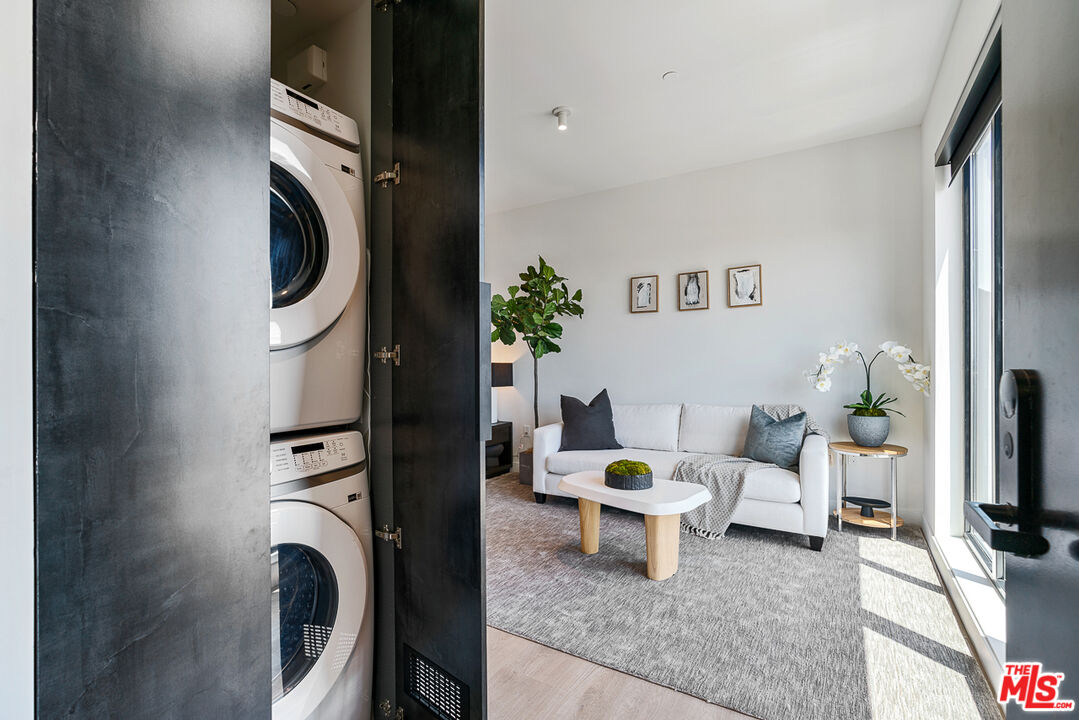 10700 Tabor Street, Unit PH5 Los Angeles, CA 90034 - Photo 3 of 26 a living room with furniture and a fireplace
