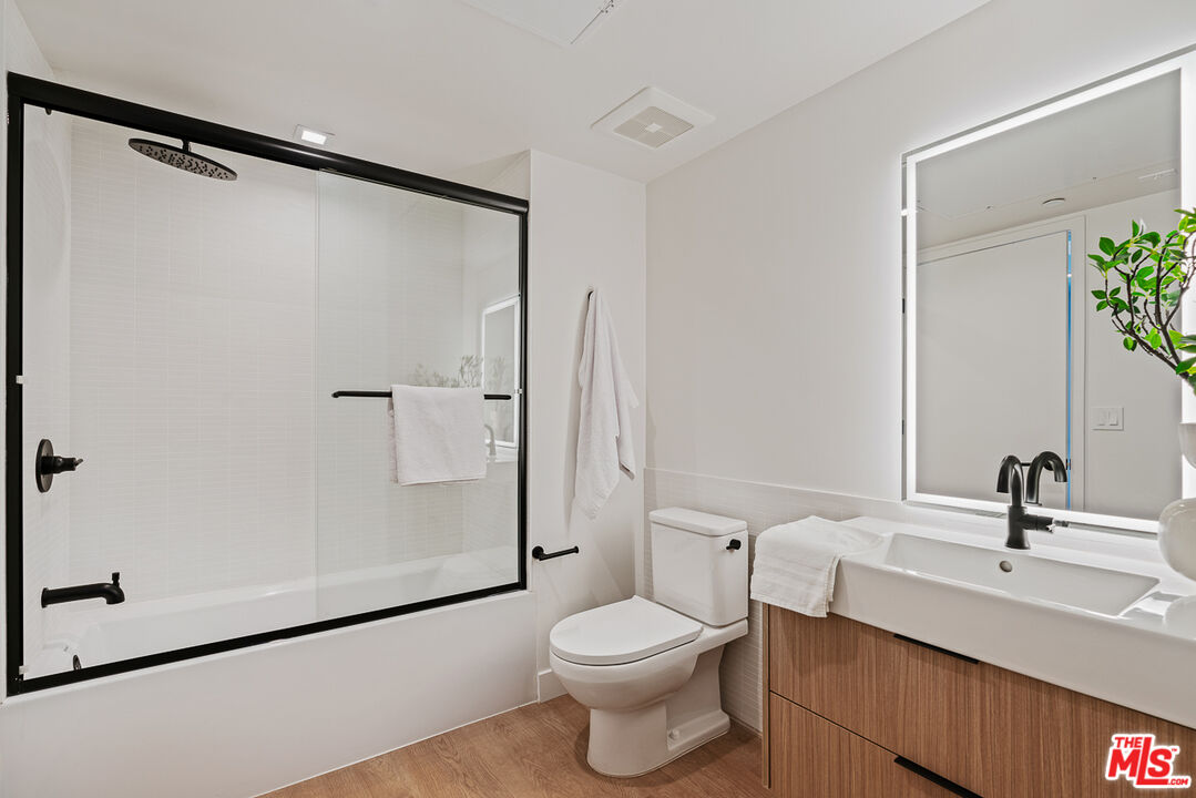 10700 Tabor Street, Unit PH5 Los Angeles, CA 90034 - Photo 5 of 26 a bathroom with a sink toilet and shower