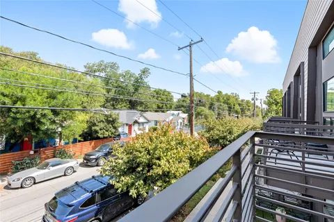 a view of street with parked cars