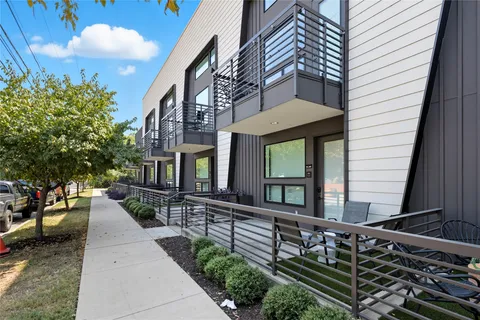 a backyard of a house with outdoor seating