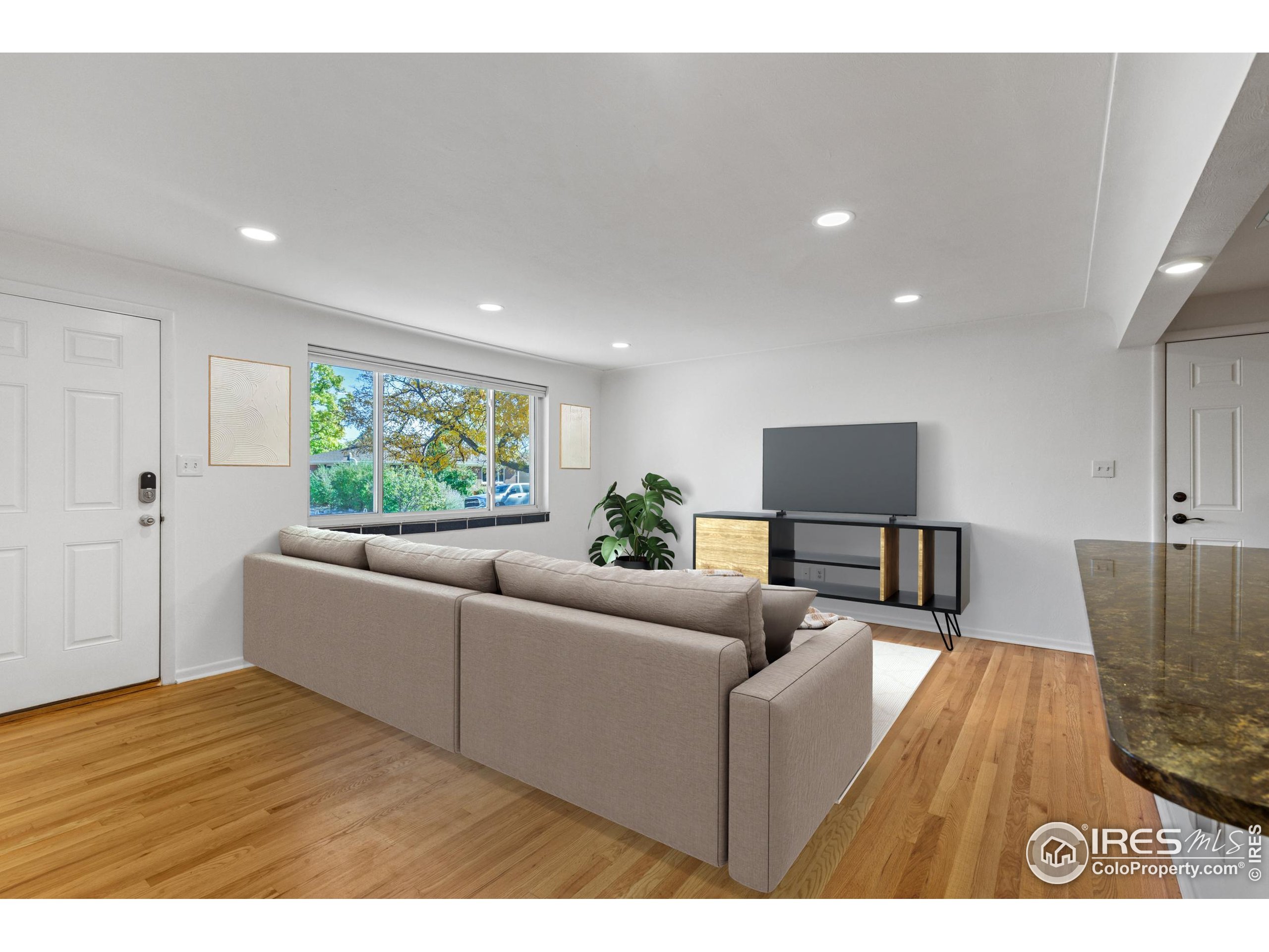725 South 45th Street Boulder, CO 80305 - Photo 15 of 44 a living room with furniture and a flat screen tv
