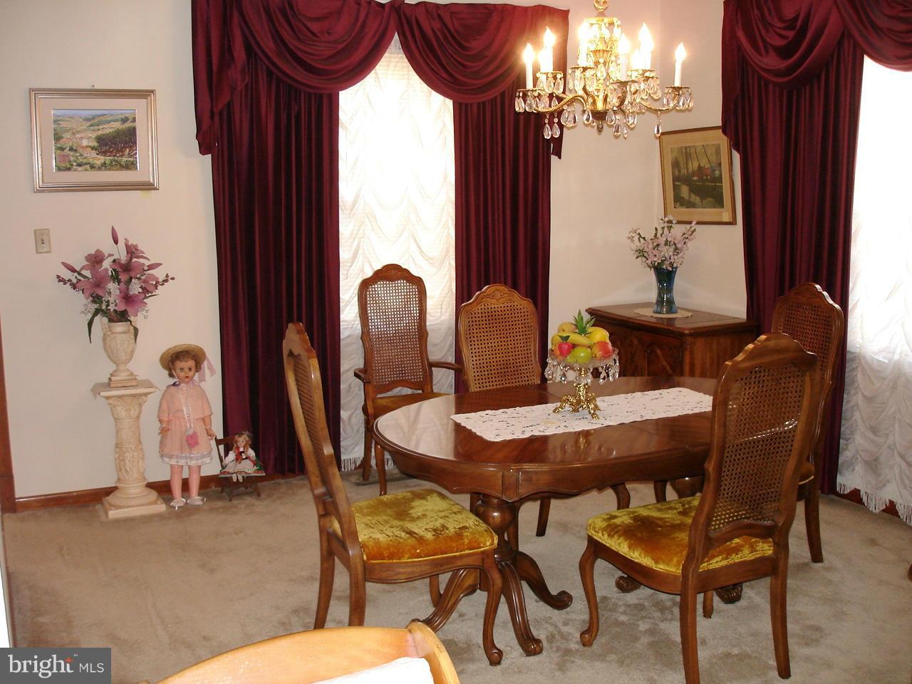373 Nicholson Road Baltimore, MD 21221 - Photo 3 of 25 a view of a dining room with furniture and a chandelier