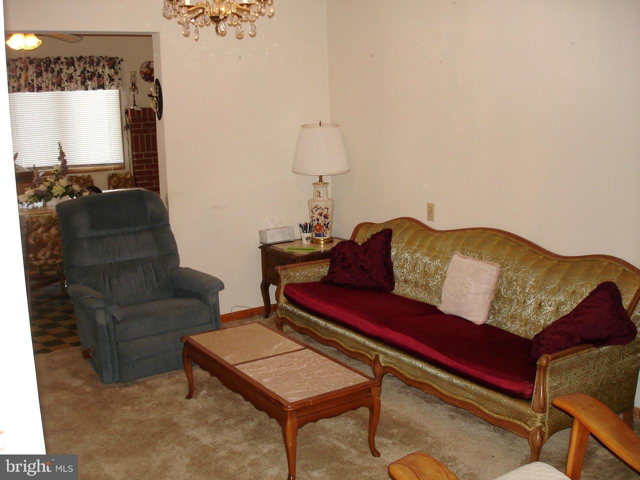373 Nicholson Road Baltimore, MD 21221 - Photo 5 of 25 a living room with furniture and a window