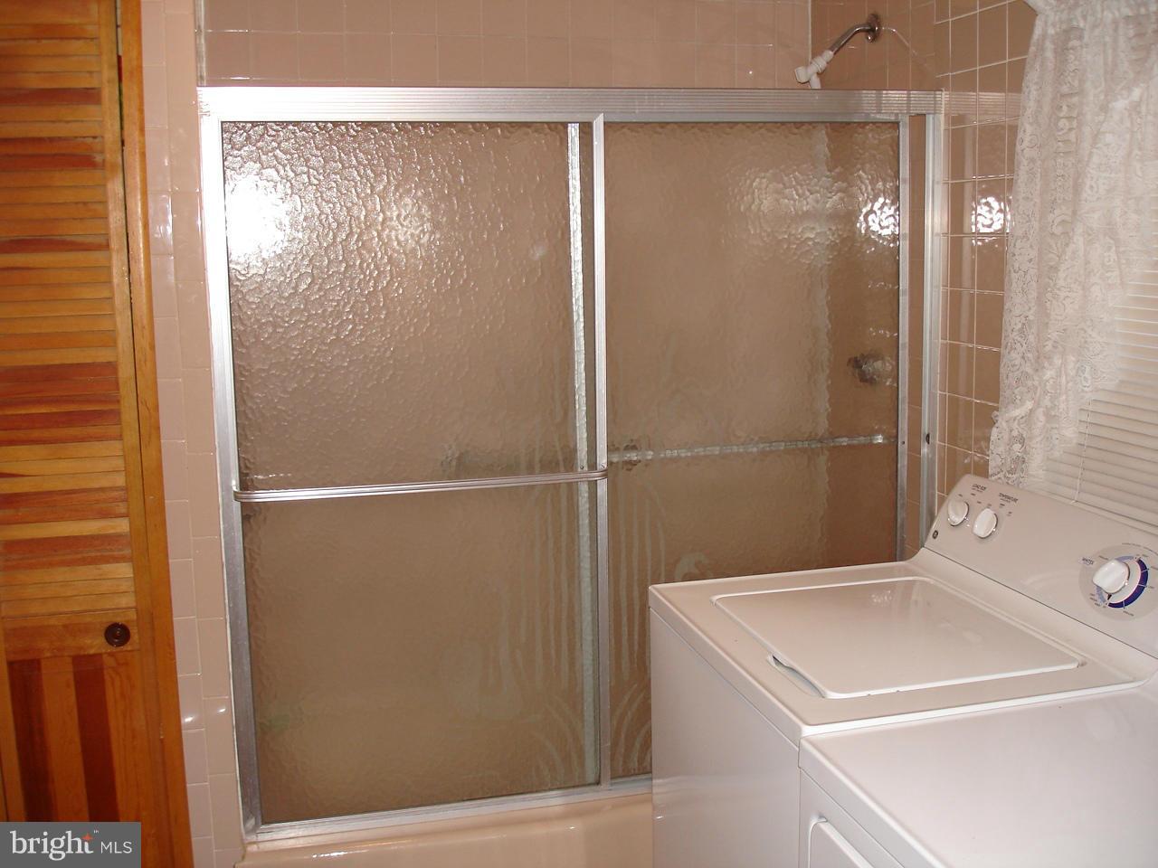 373 Nicholson Road Baltimore, MD 21221 - Photo 8 of 25 a bathroom with a shower and a sink