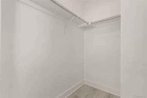a view of an empty walk in closet