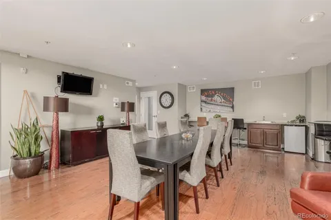 a view of a dining room with furniture and wooden floor