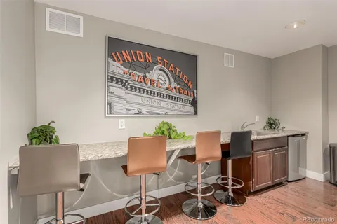 a workspace with furniture and wooden floor