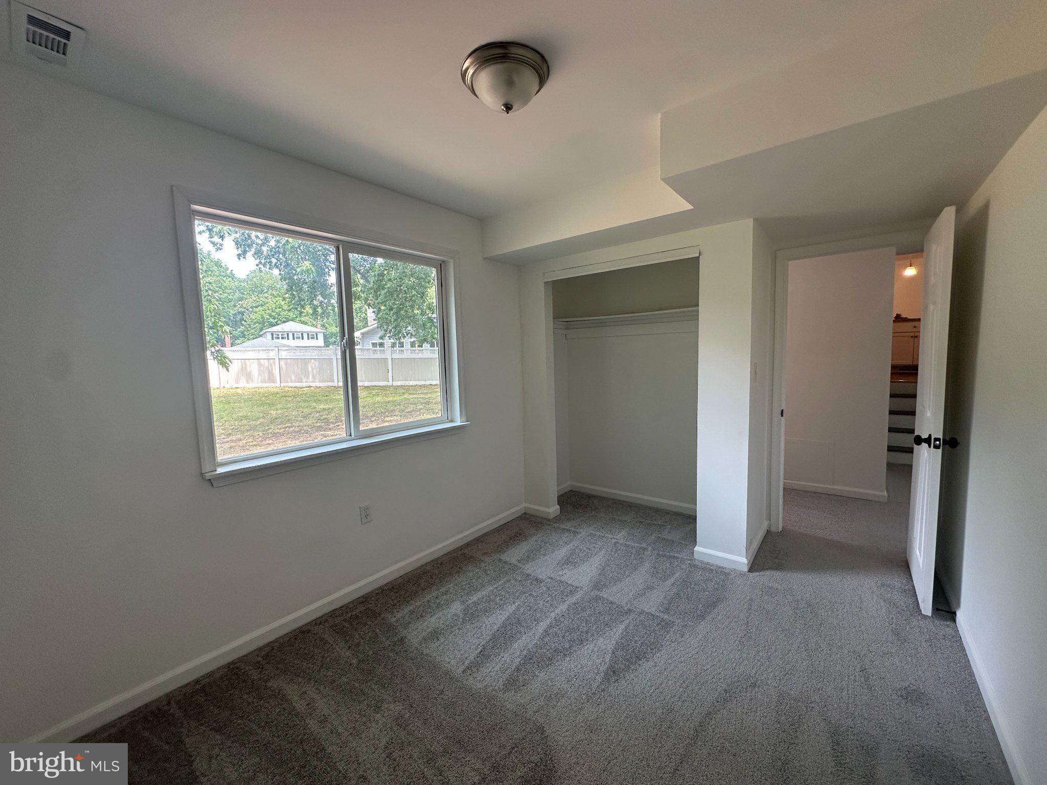 6 Travertine Way Newark, DE 19702 - Photo 6 of 22 an empty room with windows and closet
