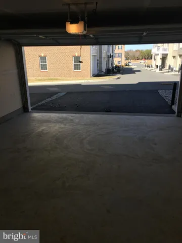 a front view of a house with parking space