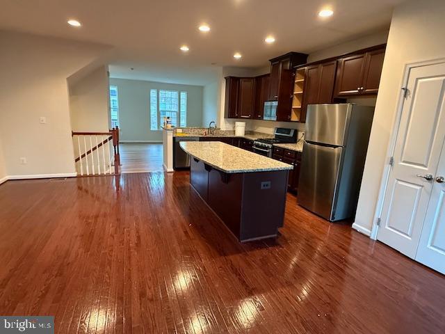42608 Smokey Embers Terrace Sterling, VA 20166 - Photo 2 of 13 a kitchen with stainless steel appliances granite countertop a refrigerator a sink and wooden floors