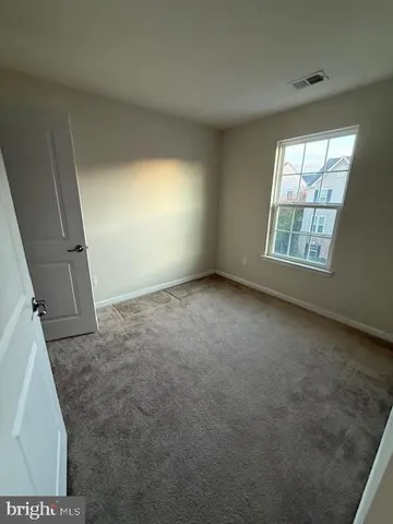 a spacious bathroom with a double vanity sink a mirror and a bathtub