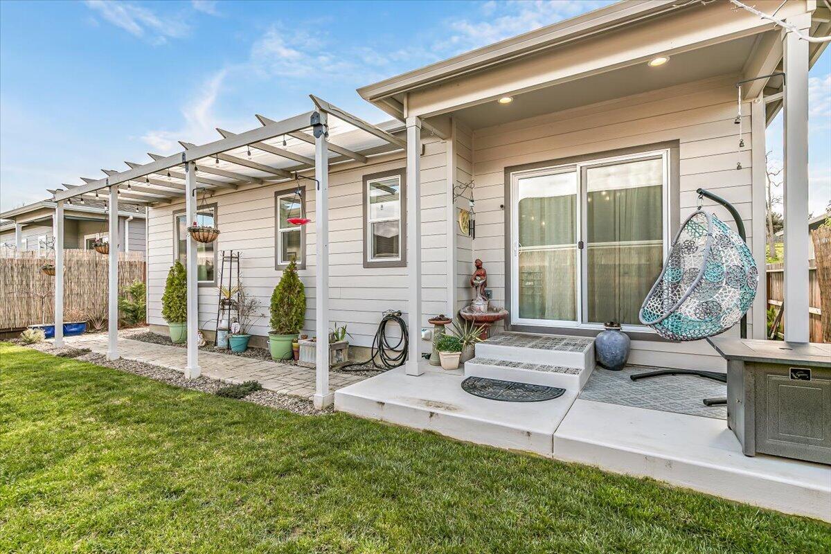 248 Christopher Way Talent, OR 97540 - Photo 29 of 33 a view of a house with backyard porch and sitting area