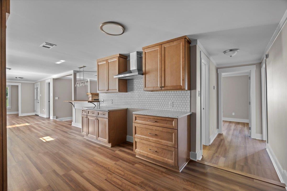 101 Sivil Circle Covington, TN 38019 - Photo 29 of 40 a open kitchen with white cabinets and wooden floor