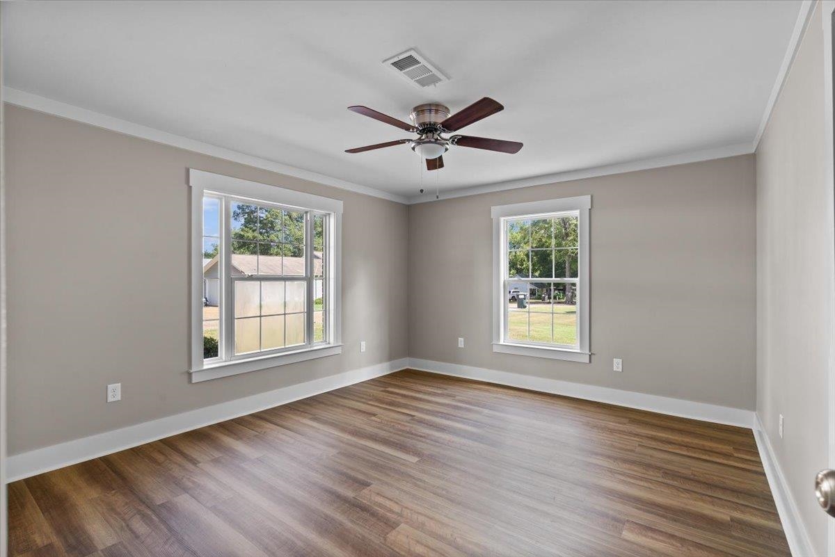 101 Sivil Circle Covington, TN 38019 - Photo 39 of 40 a view of an empty room with wooden floor and a window