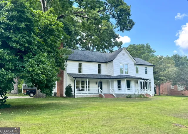 a view of a house with a swimming pool