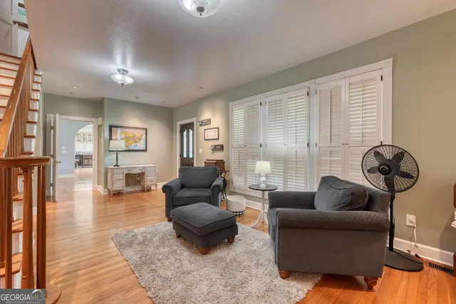 a kitchen with a sink a stove and cabinets