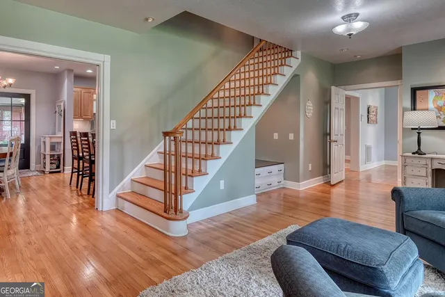 a spacious bedroom with a bed and a tv