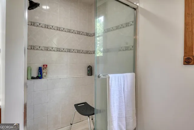 a living room with furniture and a gym