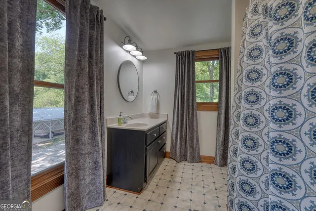 a view of a house with a yard and garage