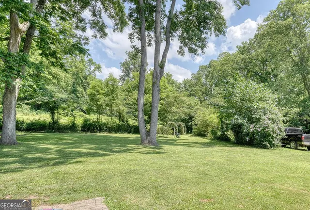 a house with trees in the background