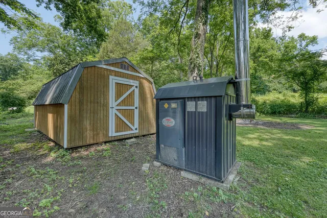 a view of a house with roof deck and furniture