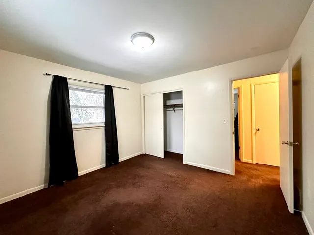 a view of empty room with front door