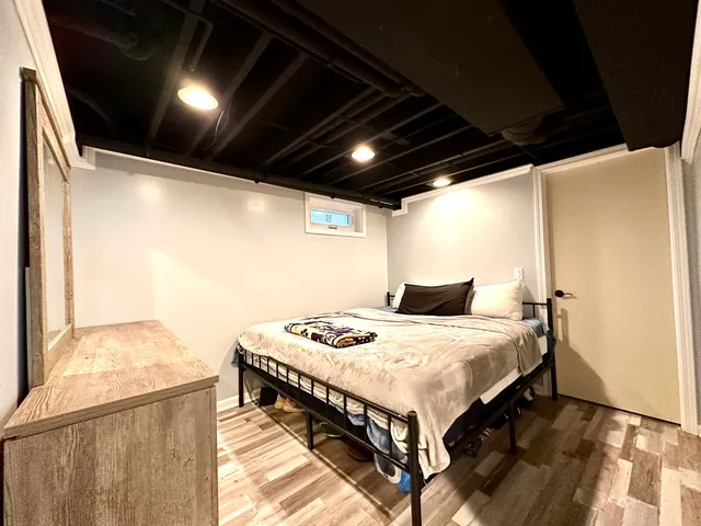 a bedroom with a bed and a table