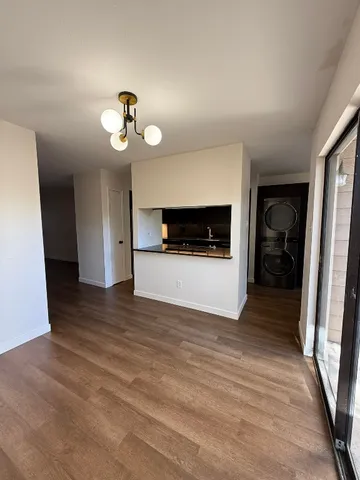 a view of a kitchen from the hallway